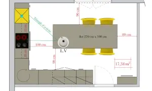 Plan d'une cuisine avec îlot central, évier, plaques de cuisson et réfrigérateur. L'espace autour de la table de salle à manger est optimisé.