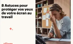 Femme fatiguée, se massant les tempes, les yeux irrités par l'écran au travail.