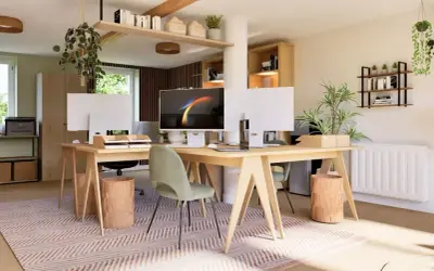 Bureau lumineux et aéré avec deux postes de travail, plantes vertes et étagères. Un espace ouvert idéal pour la productivité.