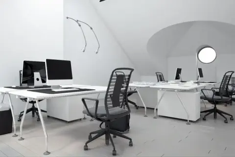 Bureau moderne avec postes de travail épurés, chaises ergonomiques et éclairage soigné, idéal pour le métier d'ergonome.