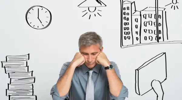 Un homme épuisé, accablé par le stress du travail, semble souffrir d'insomnie. Des dessins symbolisent le temps qui passe, la fatigue et la pression.