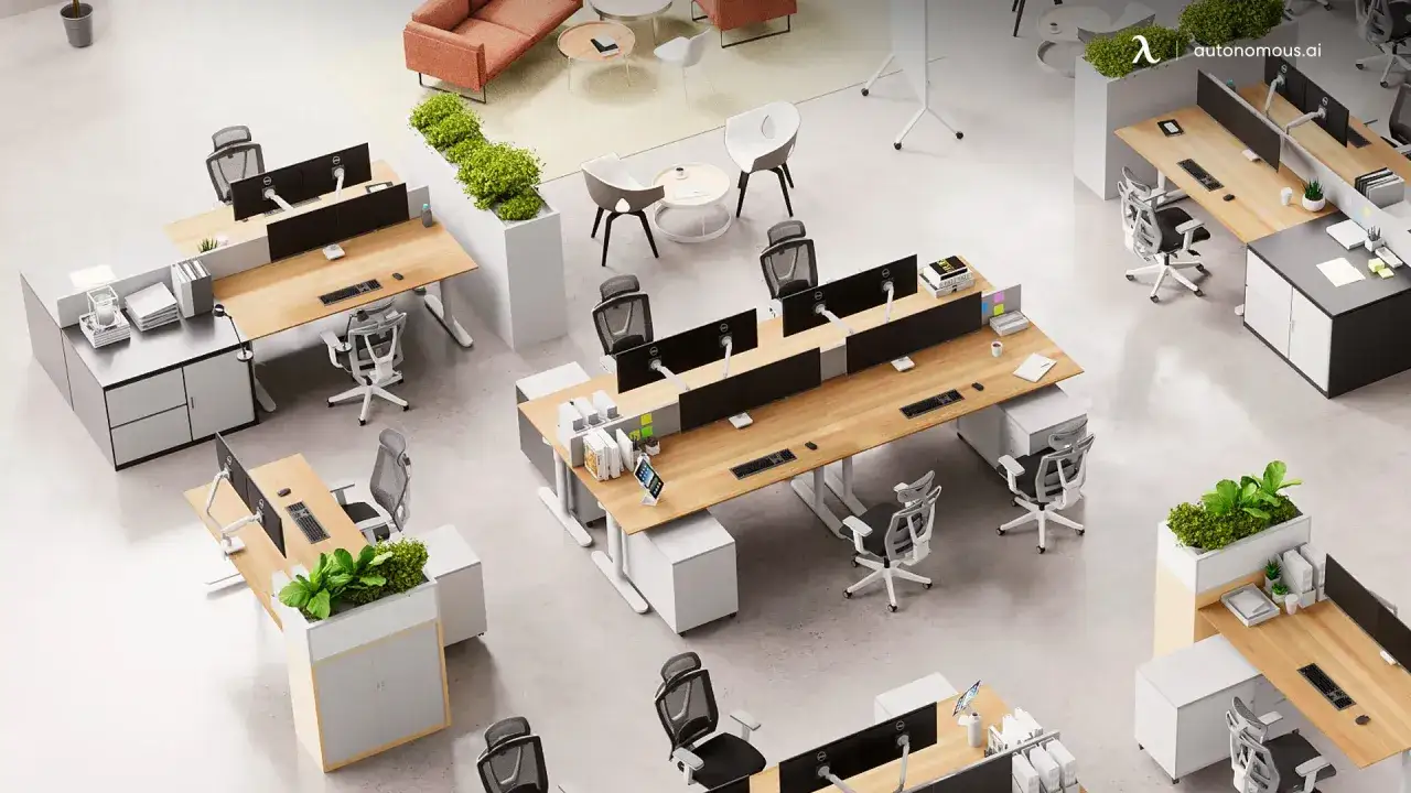 Vue aérienne d'un bureau moderne avec plusieurs postes de travail. La distance entre 2 bureaux dos à dos est optimisée pour l'espace.